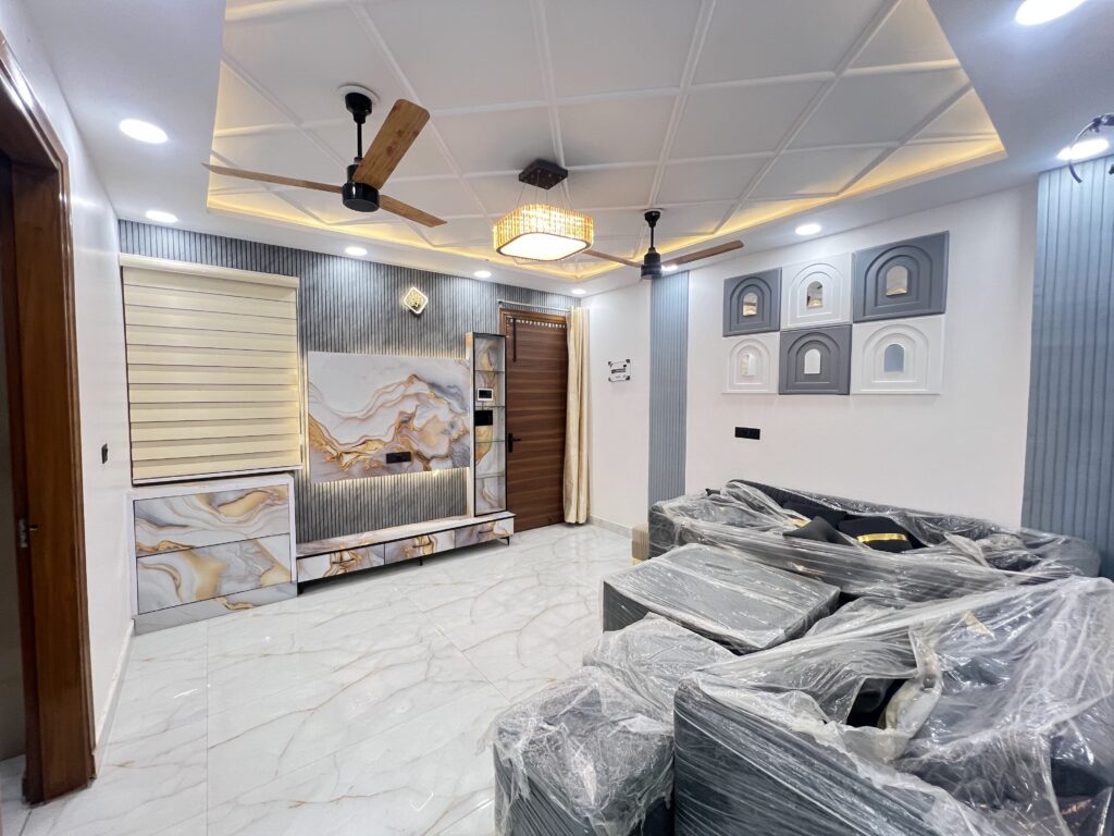 Spacious 3BHK flat in Uttam Nagar West Delhi with modern interior, balcony, modular kitchen and parking facility.